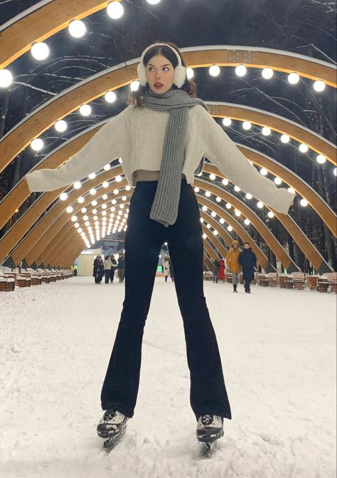 girl skating in earmuffs