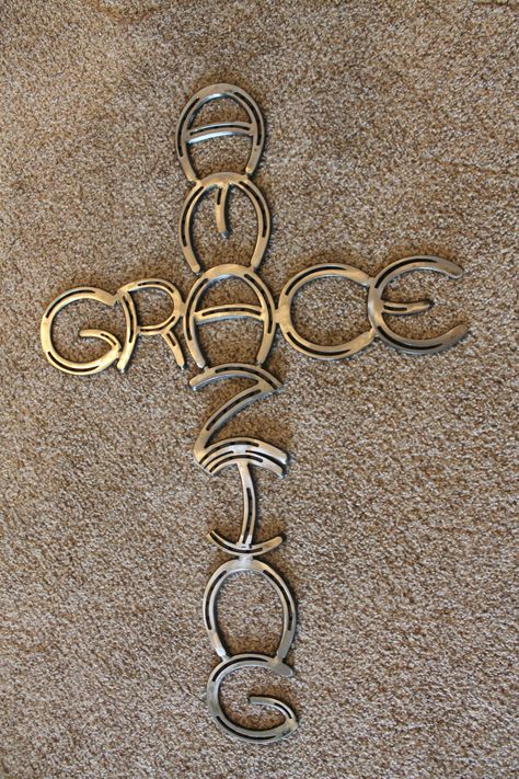 Horseshoe Amazing Grace cross made of new horseshoes fully welded and powder coated to last a lifetime. This cross would be the perfect addition to any wall or home decor. Give this beautiful cross to the special person in your life. This cross is 34 inches long and 22 inches wide. All pieces now come powder coated. Rebar Welding Projects, Horseshoe Letters, Easy Welding Projects, Horseshoe Cross, Amazing Grace Cross, Adult Baptism, Horseshoe Crafts Projects, Cool Welding Projects, Hymn Art