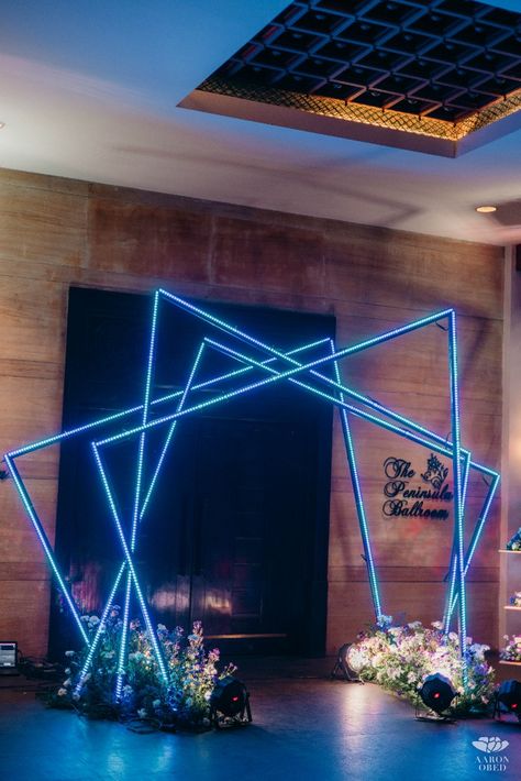 Call 9867018889 or DM The Wedding Experience to plan your dream wedding! A high glitz event with lots of fun geometry play in a rich blue colour scheme #explorepage #TWEx #mehendidecor #mehendibackdrop #mehendithemes #destinationwedding #chennaiweddingvenues #weddingplanners #bridalcorner #nightmehendi #weddingdecortrends2023 #weddingthemes #tropicalmehenditheme #weddingsofchennai #decorsutra #weddingwirein #wedmegood #weddingsutra #wedmegoodsouth #ezwed Led Event Decor, Neon Theme Wedding Decor, Futuristic Event, Neon Event, Cocktail Table Decor, Unique Event Decor, Blue Colour Scheme, Sangeet Decor, Instagram Planning