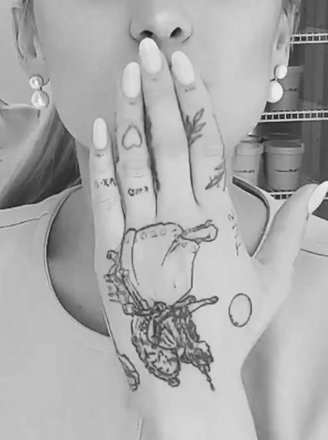 ariana grande new tattoo rem beauty secrets vogue wicked Moonlight Tattoo, Hand Tatto, Ariana Grande Tattoo, Rem Beauty, Ariana Grande News, Finger Tats, Wicked Tattoos, Tiny Elephant, Ariana G