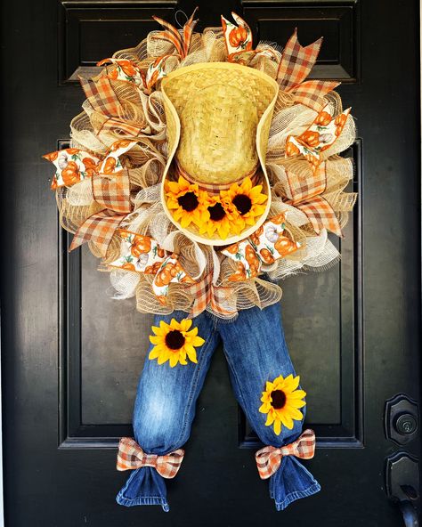 Welcome your guests with this adorable scarecrow hung on your front door. This cute wreath makes the perfect gift for every fan of sunflowers and farm decor! Diameter: 20 inches Weight: 4lbs Length: 30-33 inches  Please Note: All wreaths are made by hand and ribbon patterns may vary slightly. Wash of denim (light-dark blue) will vary so PLEASE specify if you have a preference, THANK YOU! Sunflowers And Pumpkins, Cowboys Wreath, Scarecrow Hat, Fall Deco Mesh Wreath, Fall Decor Wreaths, Fall Deco Mesh, Scarecrow Wreath, Fall Scarecrows, Mesh Wreath Diy