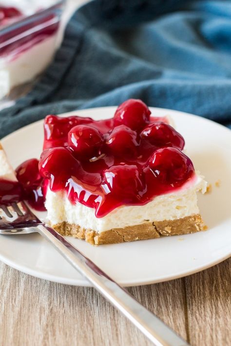 the best no bake cherry cheesecake made in a 9x13 pan that can be made with or without cool whip. Instead of cool whip use heavy whipping cream. An easy summer dessert with a graham cracker crust. #nobake #cherrycheesecake #cherry #cheesecake Cheesecake Poke Cake, Pie Topping, Raspberry No Bake Cheesecake, No Bake Cherry Cheesecake, No Bake Blueberry Cheesecake, Cheesecake Pudding, Poke Cake Recipes, Duncan Hines, Poke Cakes