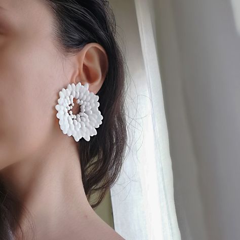 Matte white flower stud earrings on model White Futuristic, Infinity Earrings, 3d Printed Jewelry, Printed Jewelry, Lightweight Earrings, Jewelry Unique, Unique Gifts For Her, Light Weight Earrings, Black Matte