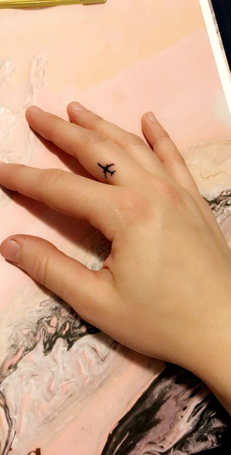 #travel #tattoos #tiny #plane #ink #fingertattoo Airplane Tattoo On Finger, Plane Finger Tattoo, Airplane Finger Tattoo, Tiny Travel Tattoo, Plane Tattoo Design, Paper Airplane Tattoos, Tattoos Tiny, 2024 Tattoo, Plane Tattoo