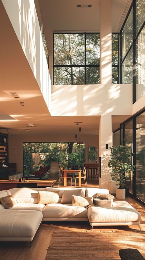 Serene and stylish contemporary home interior with sunlight streaming through large windows, showcasing elegant furnishings and architectural details. Quiet Luxury Home, Sunlit Room, Room Nature, Contemporary Home Interior, Modern Exterior Doors, Futuristic Interior, Interiors Dream, Hosting Guests, Elegant Interiors