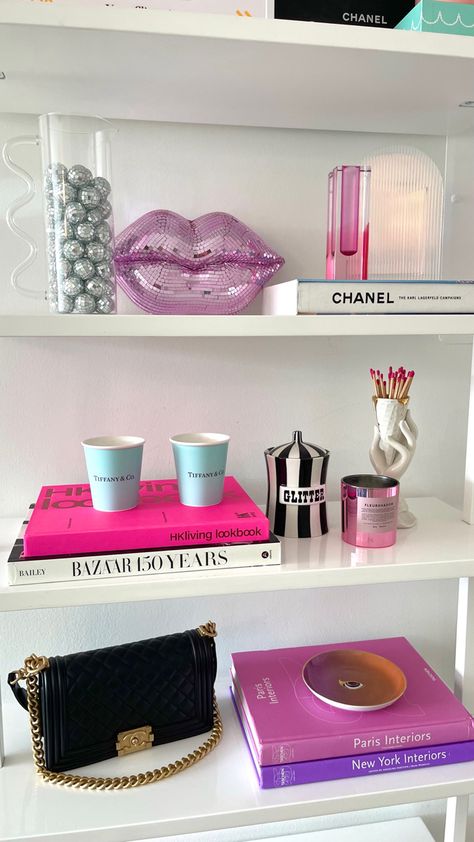 Cb2 bookshelf styling colorful home decor, pink home decor Rhinestone Decor Home, Pink Apt Decor, Shelf Decor Room Ideas, College Apartment Coffee Table, Coffee Book Decor, Jonathan Adler Style, Jonathan Adler Office, Shelf Decor Bedroom Colorful, Book Shelf Decor Ideas Bedroom