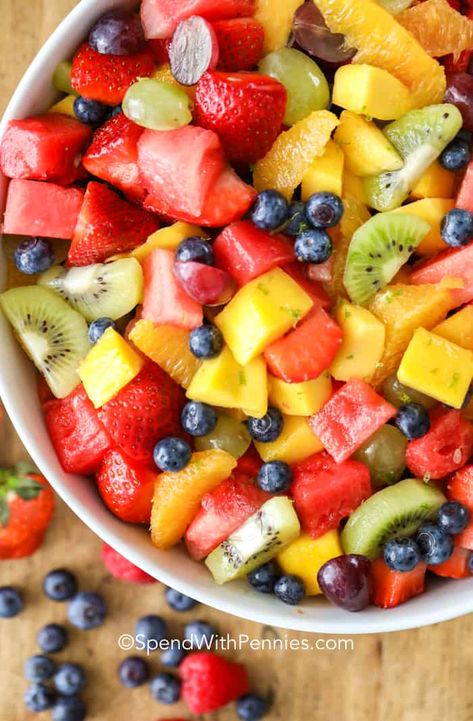 This fresh fruit salad combines all our favorites into one juicy flavorful colorful dish. With watermelon, strawberries, raspberries, blueberries, kiwis, grapes, oranges and mango this salad is sure to satisfy your fruit craving! #spendwithpennies #fruitsalad #freshfruit #summersalad #fruitcocktailsalad #dessert Mexican Fruit Salad, Fruit Cocktail Salad, Fruit Salad Dressing, Mexican Fruit, Honey Lime Dressing, Dressing For Fruit Salad, Fruit Salad Easy, Summer Salads With Fruit, Fresh Fruit Salad