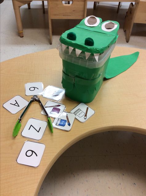 feed the alligator i use colors, numbers, shapes and numbers depending on what I'm teaching the alligator will whisper to me what it wants inside its belly and the child will find it and feed it to the alligator. Detergent Container, Number Crafts, Reading Tutoring, Magnet Crafts, Teaching Toddlers, Alphabet Crafts, Preschool Literacy, Basic Embroidery Stitches, Preschool Classroom