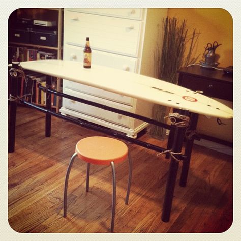 How To Make a Surfboard Table | YORK SURF Again, what a cool desk this would make!! Diy Surf Board, Surf Board Table, Man Cave Coffee Table, Surfboard Bar, 1980s Beach, Surfboard Table, Room For Man, Coffee Tables Ideas, Surfboard Decor