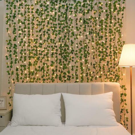 🍀SOFT & STURDY: Only high-quality materials are used in the production of fake vines for bedrooms. Made of premium silk cloth, leaves with a smooth texture are really soft. Stems made of premium plastic are durable, waterproof, and flexible. Besides, the vines are not easy to fade thanks to the special technology of dyeing. 🍀WHAT YOU’LL GET: Each package comes with 6 fake vines that are 42 ft long in total. Each vine that is 7 ft in length has about 80 leaves of different sizes Fake Vines In Bedroom, Fake Vines, Fake Ivy Decor Bedroom Ideas Ceiling, Leave Vine Room Decor, Fake Vine Bed Canopy, Fake Ivy Headboard, Vine Leaves Room Decor Aesthetic, Hanging Vines, Artificial Garland