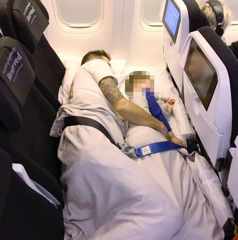 Mum shares genius flight hack to turn economy seats into a giant bed on long-haul trips - Irish Mirror Online Turn Airplane Seat Into Bed, Economy Plane Seats Into A Bed, Turn Economy Plane Seats Into Bed, Airplane Sleeping Hacks, Giant Bed, Giant Beds, Airplane Bed, Sleeping On A Plane, Plane Seats