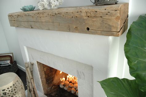 Driftwood Mantel adds plenty of texture. Driftwood Mantle, Driftwood Fireplace, Rustic Fireplace Mantle, Coastal Fireplace, Reclaimed Wood Mantel, Brick Fireplace Makeover, Wood Fireplace Mantel, Fireplace Mantel Decor, Rustic Fireplaces