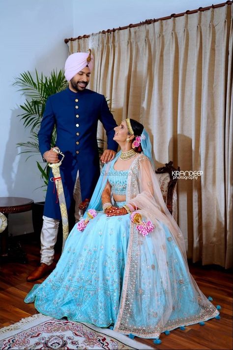 This couple paired their outfit with the bride in a light blue lehenga and the groom in a midnight blue sherwani! #weddinginspo #shaadisaga #groom #bride #bridal #weddinginspiration Light Blue Lehenga Bridal, Blue Sherwani Groom, Aqua Blue Lehenga, Light Blue Lehenga, Blue Bridal Lehenga, Kiran Bedi, Couple Dresses, Indian Fits, Blue Sherwani