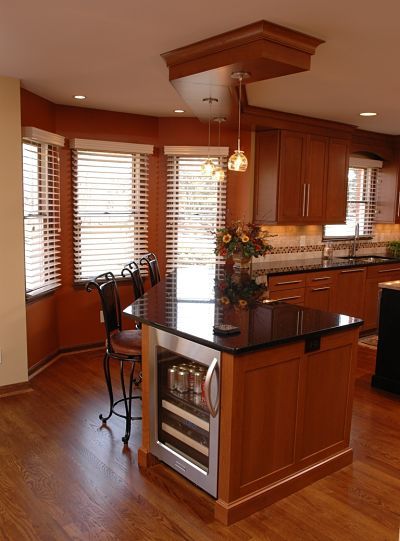 Kitchen dining area with bay window by Neal's Design Remodel. Galley Kitchen With Bay Window, Kitchen Island In Bay Window, Kitchen With Bay Window And Island, Kitchen Remodel With Bay Window, Small Bay Window Ideas Kitchens, Kitchens With Bay Windows, Kitchen With Bay Window Layout, Small Bay Window Ideas, Piano Kitchen