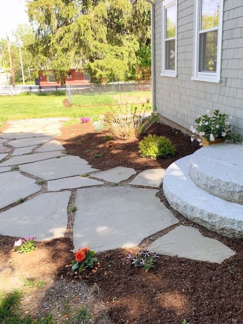 The half moon steps leading to the front door work well when paired with walkways that go off towards the side of this house. Slate Sidewalk Front Walkway, Stone Pathway To Front Door, Half Moon Front Porch Steps, Flagstone Front Walkway, Slate Walkway To Front Door, Natural Stone Walkways To Front Door, Simple Walkways To Front Door, Stepping Stones To Front Door, Front Entrance Walkway Ideas