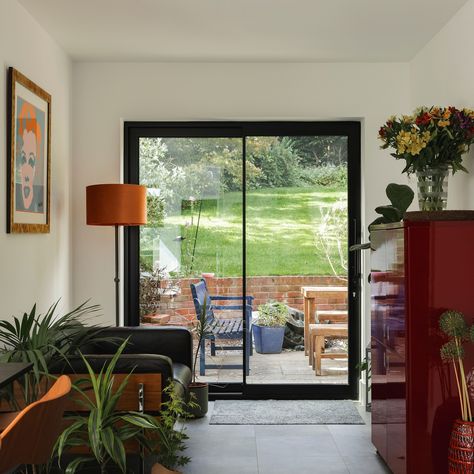 These sleek aluminium sliding doors with bold black frames are the perfect addition to this beautiful home. Not only do they offer a stunning visual statement, but they also bring a range of benefits that make them both stylish and practical! ⁠ ⁠ Sliding doors create a smooth transition between your interior and patio, bringing the outdoors in and maximising natural light. Outdoor Sliding Doors Patio, Patio Sliding Doors Ideas, Sliding Doors Patio, Back Sliding Door, Patio Door Ideas, External Sliding Doors, Timber Front Door, Sliding Doors Internal, Aluminium French Doors