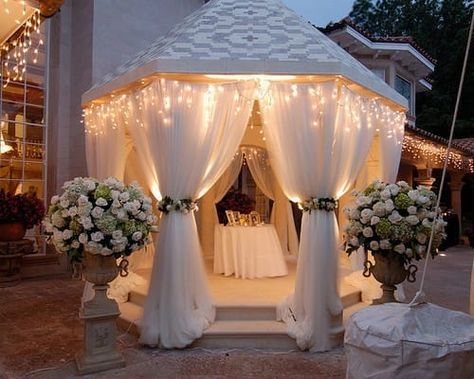 You don't have to spend a fortune to have beautiful, elegant wedding decor. Here are tips for using fabric and curtains to create a dreamlike atmosphere. Diy Wedding Gazebo, Party Ideas Outdoor, Gazebo Wedding Decorations, Gazebo Decor, Gazebo Party, Gazebo Decorations, Lights Wedding Decor, Gazebo Wedding, Flowers For Sale