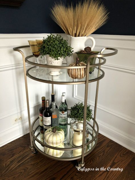 Thanksgiving Bar Cart in a Navy Dining Room.  #barcart #barcartdecor #barcartstyling #falldecor #thanksgivingdecor Thanksgiving Bar Cart, Round Bar Cart, Dining Room Navy, Dining Room Simple, Cozy Thanksgiving, Gold Bar Cart, Bohemian Farmhouse, Bar Cart Styling, Thanksgiving Inspiration