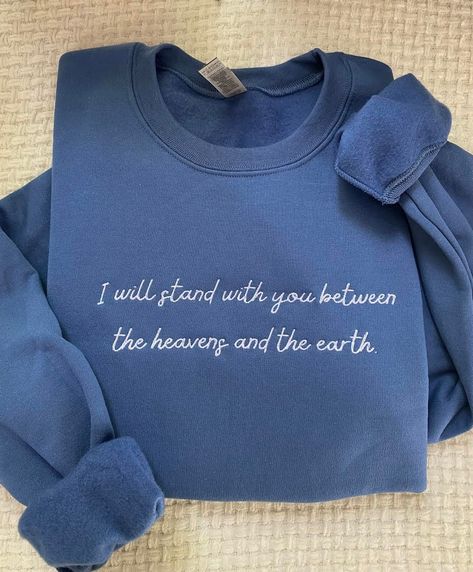 I will stand with you between the heavens and the earth embroidered sweatshirt is so cute and inspired by Queen Charlotte A Bridgerton story. This can also be known as Bridgerton merch.  FREE SHIPPING  Please allow up to 1-3 business days for the product to be made. * 50% cotton, 50% polyester * Pre-shrunk * Classic fit * 1x1 athletic rib knit collar with spandex * Air-jet spun yarn with a soft feel and reduced pilling * Double-needle stitched collar, shoulders, armholes, cuffs, and hem 10% of p Bridgerton Embroidery, My Heart Calls Your Name, Queen Charlotte King George, King George Bridgerton, Bridgerton Merch, Bookish Sweatshirts, Charlotte King, Queen Charlotte A Bridgerton Story, Aunt Sweater