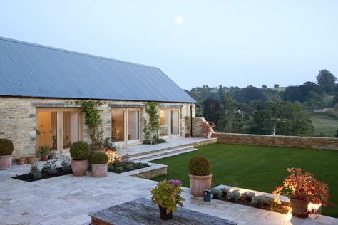 Architecturally striking barn conversion in Gloucestershire Mediterranean Farmhouse Exterior, Rustic Mediterranean Farmhouse, Barn Conversion Exterior, Farmhouse Exterior Design, Contemporary Barn, Agricultural Buildings, Barn Conversion, Exterior Stone, Modern Barn