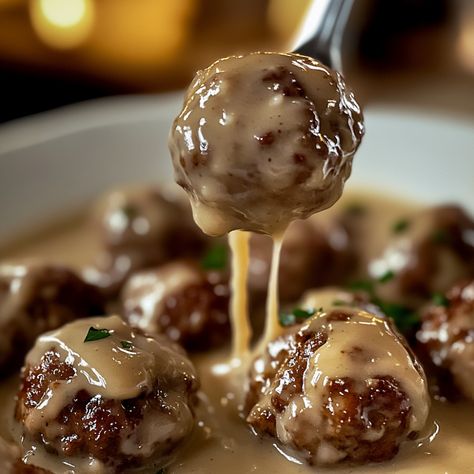 Authentic Swedish Meatballs with Creamy Gravy Recipe Authentic Swedish Meatball Recipe, Swedish Meatball Gravy, Authentic Swedish Meatballs, Sour Cream Gravy, Swedish Meatball Recipe, Swedish Cuisine, Savory Meatballs, Meatballs And Gravy, Valentine's Dinner