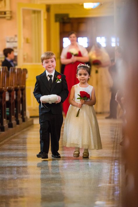 Ring bearer outfit from men's wearhouse. Ivory flower girl dress with gold trim is from David's bridal. She's carrying a bouquet of three red roses. Three Red Roses, Ring Bearer And Flower Girl, July 4th Wedding, Ivory Flower Girl Dress, Regal Rose, Bearer Outfit, Ivory Flower Girl, Ring Bearer Outfit, Ivory Flower Girl Dresses