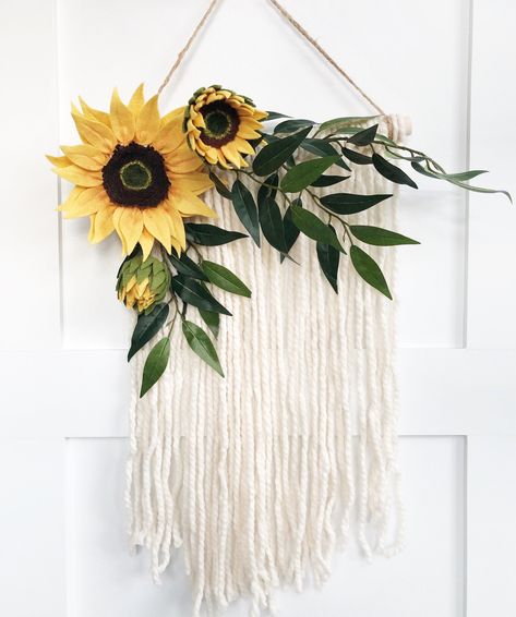 "Welcome to Heartfelt Blooms! My name is Misty and this is my felt flower shop! I love flowers but let's get real, they don't last forever. Surround yourself with beautiful flowers all year long that don't need watering! [Listing Details] This listing is for one macrame wall hanging adorned with sunflowers felt flowers! This is the perfect size to decorate a nursery, a playroom or as party decor! Width: 13-14\" Love the style but want different colors? No problem, reference the last image for co Boho Nursery Wall Decor, Sunflower Room, Sunflower Nursery, Sunflower Wall Decor, Sunflower Crafts, Sunflower Baby Showers, Pink Felt, Girl Nursery Room, Wall Hanging Boho