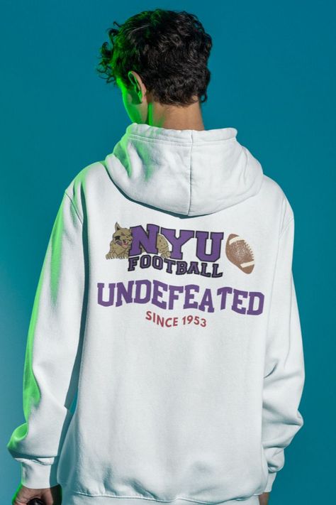 As an NYU grad, I think these funny "NYU Violets Football" hoodies will definitely be a conversation starter. NYU Violets Football was established in 1873-1952. Hence, “Undefeated since 1953.” 😄🏈 Their mascot was a bobcat. These vintage inspired NYU hooded sweatshirts are a great college gift for teachers, students and parents wanting to represent their university or their children’s. Football Hoodies, New York University, York University, College Gifts, Dec 26, Funny Vintage, Vintage Humor, Football Team, San Jose