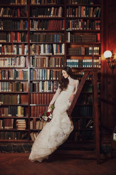 Modern bridal portrait ideas. Bride leaning on ladder in front of timeless book display. Private wedding venues in NYC.   Planning | @aniwolff_ Ceremony venue | @stpatrickscathedral Photography @andrewkellyphoto & @fjello for @christianothstudio Reception venue | University Club Photography | @christianothstudio Videography | @mckenziemfilms Florals | @fleursnyc Beauty | @beautini Library Wedding Dress, Library Pre Wedding Shoot, Vintage Library Photoshoot, Philadelphia Library Wedding, Downtown Bridal Shoot, Library Bridal Portraits, Global Wedding, Private Wedding, Bridal Photoshoot