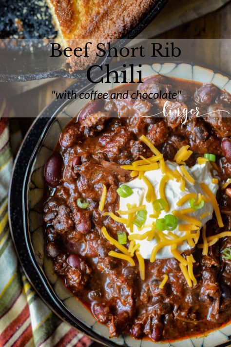 The complexity of flavors in this Beef Short Rib Chili recipe makes it the ultimate comfort food. Dried Ancho and California chile peppers are the keys to its depth and intensity. Chocolate and Coffee, the secret ingredients, add to its richness. Top it off with tender chunks of meat that just about melt in your mouth. #beefchili #beefshortribs Short Rib Chili Slow Cooker, Short Rib Chili Recipe, Prime Rib Chili, Rib Chili Recipe, Short Ribs Chili Recipe, Chili Competition, Short Rib Chili, Chili Contest, Chili Cookoff