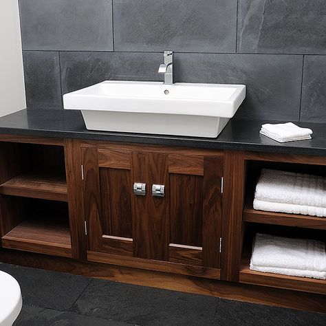 American Black Walnut vanity unit with honed black granite top and natural slate splashback combine to gives a masculine feel for this luxurious en-suite. #bathroom #relaxation #design #interiordesign #ensuite #luxuryliving #vanityunit Wash Counter, Honed Black Granite, Wooden Vanity Unit, Vanity In Bathroom, Luxury Ensuite, Granite Bathroom Countertops, Black Tile Bathrooms, Walnut Vanity, Paddle Tennis