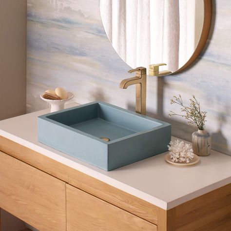 Sleek and glamorous, Nipomo can dress up your bath in many different styles. Display it above the counter as a vessel, install it behind cabinetry as an undermount, or showcase it as a farmhouse apron-front. The 19" concrete vessel bathroom sink's matte texture adds an understated luxury to any bathroom. Artisan-crafted using NativeStone: an innovative blend of cement and natural jute fiber, Nipomo is resilient enough for heavy-duty tasks with a refreshingly easy cleanup. - Model: NSL1915-O -... Concrete Farmhouse, Concrete Bathroom Sink, Farmhouse Bathroom Sink, Apron Front Sink, Concrete Bathroom, Sink Sizes, Farmhouse Aprons, Undermount Bathroom Sink, Sink Bathroom