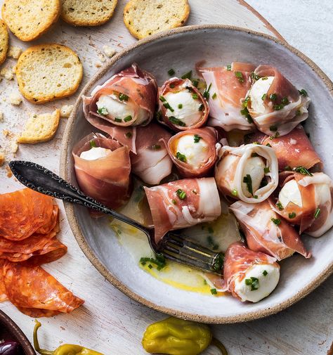 Prosciutto-Wrapped Mozzarella Balls Appetizer | Yankee Magazine Mozzarella And Prosciutto Appetizers, Prosciutto Mozzarella Appetizer, Prosciutto Wrapped Mozzarella, Mozzarella Prosciutto Appetizer Recipes, Prosciutto Wrapped Cheese, Seasoned Mozzarella Balls, Mozzarella Appetizer Ideas, Mozzarella Ball Appetizers, Mozzarella Recipes Appetizers