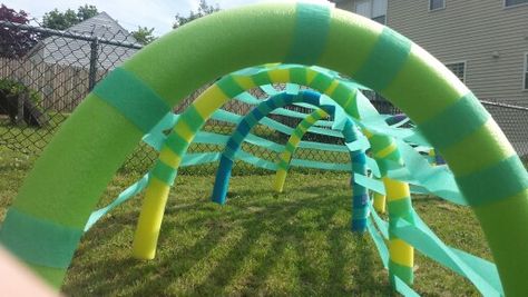 Tunnel to crawl through during Mario obstacle course! Pool noodles secured using marshmallow skewers pushed into the ground. Streamers wrapped around. Mario Obstacle Course, Marshmallow Skewers, Mario Kart Party, Picnic Games, Kids Obstacle Course, Mario Bros Birthday, Nerf Party, Super Mario Birthday Party, Mario Birthday Party