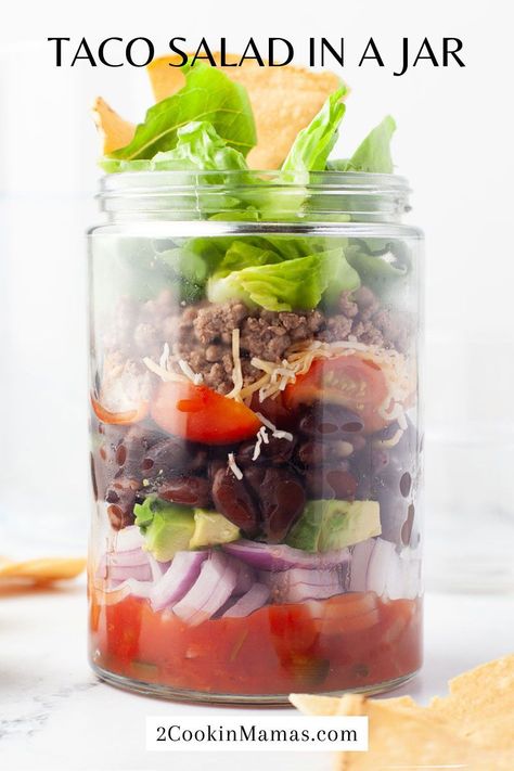 Shake up your lunch or weeknight dinner with this easy and delicious Taco Salad in a Jar! Layers of crunchy goodness with crispy lettuce, seasoned ground beef, cheese, tortilla chips, and all your favorite taco toppings all stacked in a jar. Just pop the lid and enjoy! #tacosalad #easylunch Taco Salad In A Jar, Taco Salad Ingredients, Strawberry Chicken Salad, Mason Jar Recipe, Taco Toppings, Seasoned Ground Beef, Tortellini Salad, Cucumber Tomato Salad, Layered Salad