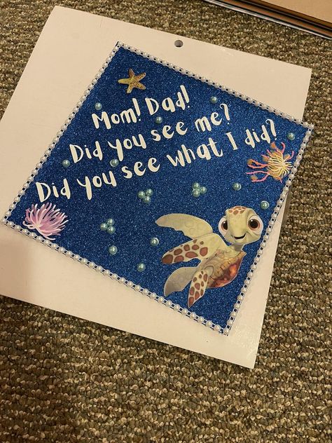 Walt Disney World Tips and Tricks | Had to share my UF Graduation cap topper Finding Nemo Cap Decoration, Lilo And Stitch Cap Graduation, 2d Graduation Cap Designs, Squirt Graduation Cap, High School Grad Cap Ideas Disney, Brave Graduation Cap, Grad Cap Memorial Ideas, Turtle Graduation Cap, Athletic Training Graduation Cap