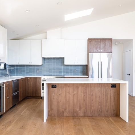 Bilden designed and built two modern bathrooms using IKEA’s godmorgon cabinets, and a great modern kitchen with sektion cabinets. In the kitchen, they utilized our Walnut Natural Wood Slab on the lowers, and White High-Gloss Acrylic Slab on the uppers. The dark wood and white cabinets always create a great contrast, but it’s enhanced by the light blue tiles on the backsplash, and they chose to let the walnut around the refrigerator break up the white upper span. White Upper Cabinets Walnut Lower, Wood Lower Cabinets White Upper, White Uppers Wood Lowers, White Upper Cabinets Wood Lower, Marigold Kitchen, Modern Rustic Kitchen Design, Rustic Kitchen Design Ideas, Sektion Cabinets, Light Blue Tile