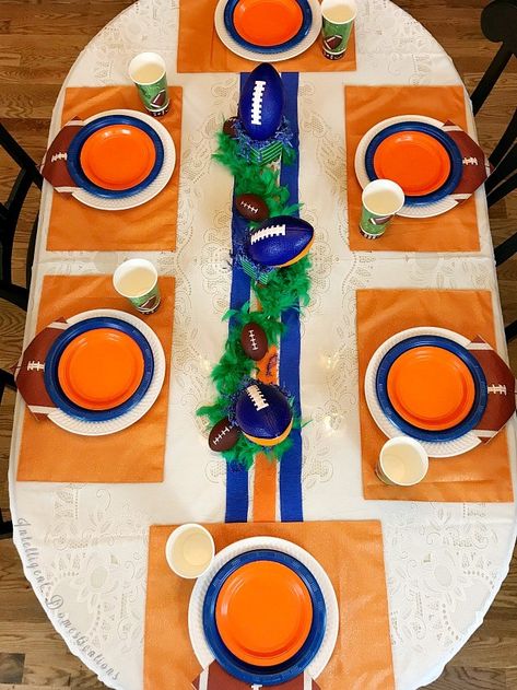 This Auburn color scheme football party table was created for a teen birthday celebration. These colors and ideas can be used for any team with Blue and Orange colors. Sports theme birthday party ideas. Blue and Orange Football Party Table Decor. SEC Football Party. #footballparty #blueandorangeparty #teenboyparty #teenbirthday #sec #Auburnparty #homegating #dollarstore #sporttheme #teamcolors Color Schemes Party, Football Party Table Decor, Football Party Table, Gator Party, Kids Party Snacks, Football Banquet, Football Crafts, Football Spirit