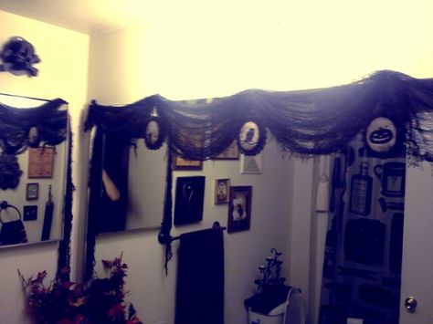 Creepy cloth drapes over the bathroom mirror with Halloween ornaments hanging from the swag points. Holiday Decor Halloween, Halloween Ornaments, Decor Halloween, Oct 11, Valance Curtains, Halloween Decor, The Bathroom, Halloween Decorations, Bathroom Mirror