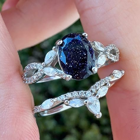 A nature inspired ring set that holds the starry night sky and looks like it would be straight out of ACOTAR 🌌 Among the Stars is a 925 sterling silver ring set holding a blue sandstone. A unique ring set filled with stars and magic ✨ #bluesandstonering #bluesandstone #bluegoldstone #acotar #nightcourt #velaris #rhysandfeyre #gemstonejewelry #crystalrings #alternativeengagementrings #uniquerings #crystalringset #promisering #starrynight #princessring #fantasyjewelry #fairytalejewelry Night Sky Ring, Acotar Ring, Night Court Wedding, Starry Night Wedding Theme, Star Themed Wedding, Celestial Wedding Theme, Nontraditional Engagement Rings, Wedding Web, Blue Sand Stone