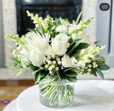 White And Green Bridal Shower Centerpiece, Classy White Floral Arrangement, Simple White And Green Floral Centerpieces, Cream And Green Floral Arrangements, Low Flower Arrangements For Table Wedding, Simple Elegant Floral Arrangements, Dainty Floral Arrangement, White And Green Vase Arrangements, Rehearsal Dinner Flowers Simple Centerpieces