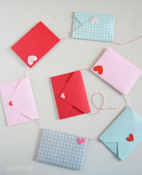 This Mini Envelope Valentine Banner is the perfect addition to your Valentine decor. The mini envelopes are so cute and the puffy heart stickers make the perfect "stamps." Create your own with the tutorial on the blog. Heart Sticker Craft, Mini Envelopes Ideas, Diy Valentine Envelopes, Valentines Day Envelopes Diy, Envelope Garland, Diy Mini Envelopes, Mini Envelopes Diy, Envelope With Heart, Valentine Dance