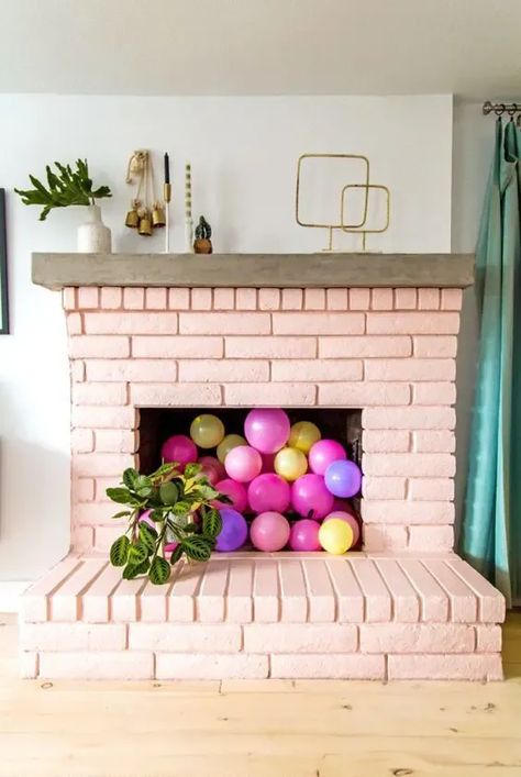 Just because your fireplace is empty doesn’t mean it has to stay that way! Check out these 12 inspiring ideas for how to style and use your unused fireplace. Pink Brick Fireplace, Terrace Cottage, Empty Fireplace Ideas, Unused Fireplace, Red Brick Fireplaces, Bold Tile, Painted Brick Fireplace, Painted Brick Fireplaces, Running Bear