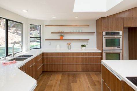 Opting for walnut cabinetry for your kitchen might be one of your life’s best decisions. But have you ever thought of adding some more style to your walnut kitchen? For example, the door-style? Walnut provides for a rustic quality that gives the kitchen a timeless appeal. Contemporary Walnut Kitchen, Walnut Kitchen Cabinets, Caesarstone Countertop, 1960s House, Walnut Kitchen, Walnut Cabinets, Mid Century Modern Kitchen, Mid Century Kitchen, Grey Kitchens