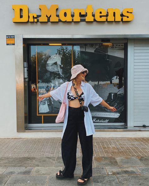 Girl in dr martens sandals with oversized white button down, floral bikini top and wide leg black pants outfit Martens Sandals Outfit, Dr Martens Sandals Outfit, Dr Marten Sandals Outfit, Doc Marten Sandals, Wide Leg Black Pants, Martens Sandals, Dr Martens Sandals, Black Wide Leg Pants, Sandals Outfit