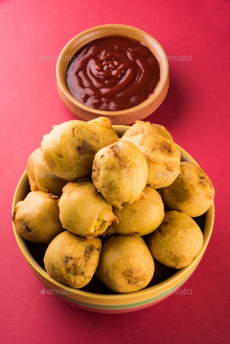 Batata Vada or Aloo Bonda by stockimagefactory. Batata Vada or Aloo Bonda is an Indian tea-time snack served with green chillies and tomato ketchup #Sponsored #stockimagefactory, #Indian, #tea, #Bonda Aloo Bonda, Batata Vada, Textures Art, Indian Tea, Tea Time Snacks, Tomato Ketchup, Breakfast Items, Ketchup, Chutney