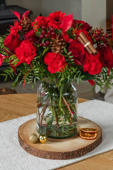 This beautiful Festivity bouquet from Prestige Flowers features red roses, carnations, geminis pinecones, hypericum and red painted birch leaves creating a floral masterpiece.
Festive flowers are the perfect way to add elegant Christmas Decor to your home, or a great Christmas gift idea for family, friends and colleagues! Christmas decoration inspiration. Red Carnations Bouquet, Red Christmas Flowers, Christmas Bouquets, Receiving Flowers, Red Rose Arrangements, Christmas Interior Design, Flowers 2023, Birch Leaves, Christmas Flower Decorations