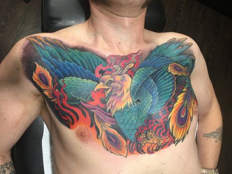 Colorful full chestpiece tattoo of a Phoenix. Compass Chest Tattoo, Chestpiece Tattoo, Best Chest Tattoos For Men, Skull Tattoo Sleeve, Chest Tattoo Wolf, Best Chest Tattoos, Chest Tattoos For Men, Full Chest Tattoos, Unique Half Sleeve Tattoos