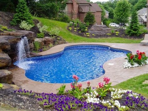 Love the color, stone accents and stamped concrete surrounding this pool. | homechanneltv.blo... #coolpools Swimming Pools Inground, Pool Waterfall, Pool Garden, Luxury Pools, Backyard Pool Landscaping, Small Pools, Dream Pools, Backyard Inspiration, Beautiful Pools