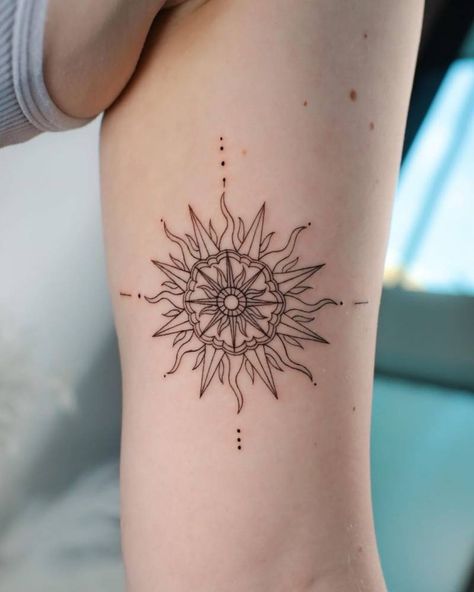 Fine line sun and compass rose tattoo on the bicep Ornamental Sun Tattoo, Mandala Sun Tattoo, Sun Tattoo Meaning, Sun Tattoo Design, Simple Sun Tattoo, Compass Rose Tattoo, Leo Tattoo, Sun Tattoo Designs, Tattoo Salon